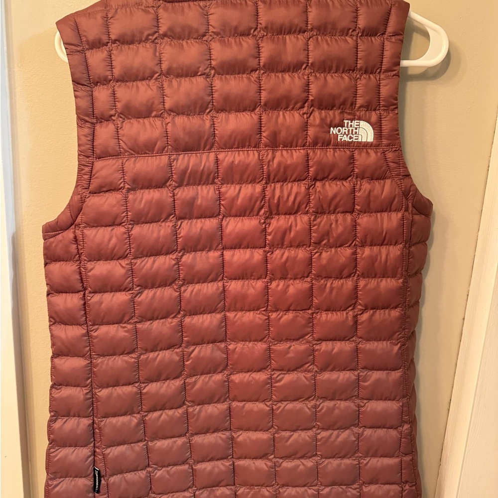 The North Face vest. 
Brand New without tag.
Never used